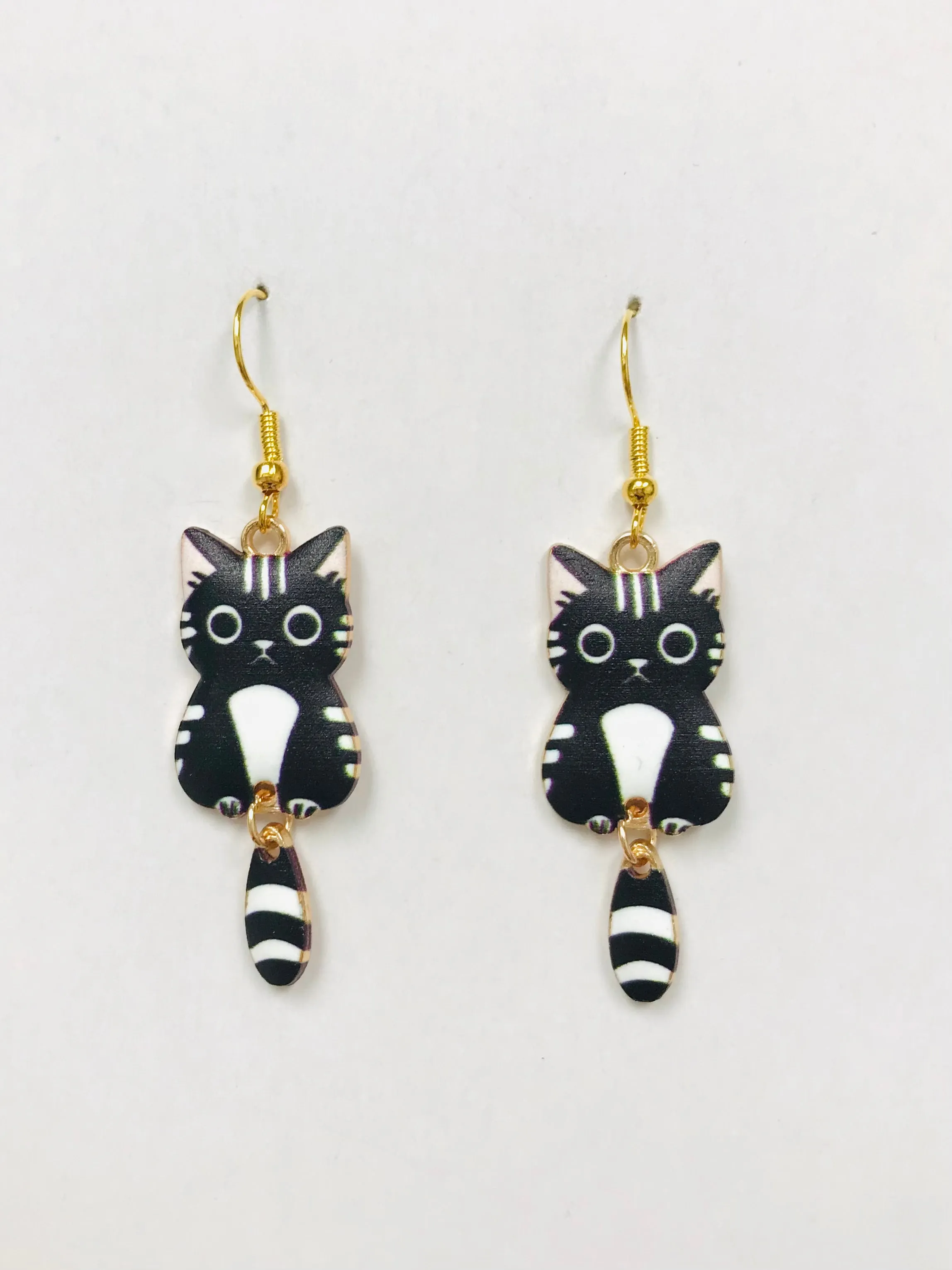 Black and White Wagging Tail Cat Earrings